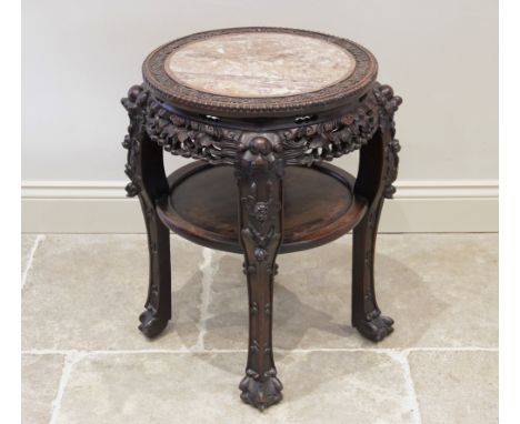 A Chinese hardwood and marble urn stand, late 19th/early 20th century, the circular top with a rouge marble inset slab, withi