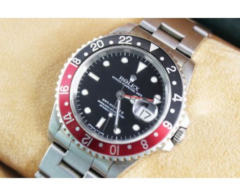 A Rolex Oyster Perpetual Date GMT Master II stainless steel wristwatch, ref.16710, the black circular dial with luminous dot 