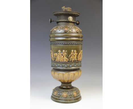 A Doulton Lambeth stoneware oil lamp, 19th century, the body with relief moulded continuous frieze depicting a colonial exped