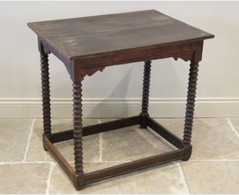 A 17th century and later oak side table, the rectangular cleated twin plank top raised upon bobbin turned supports and block 