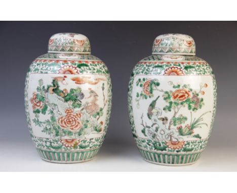A pair of Chinese famille verte ginger jars and covers, 20th century, each with a panel depicting birds in blossom to one sid