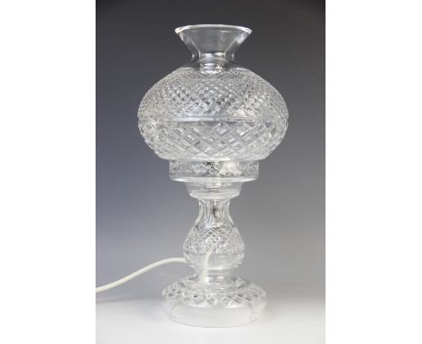 A Waterford crystal lamp base, 20th century, in the form of an oil lamp with hobnail decoration, 35.5cm high Lighting lots ar