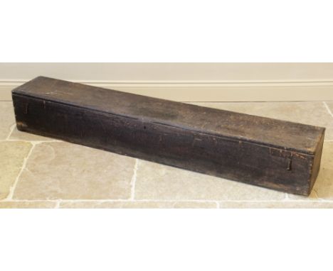A 19th century stained pine chest/trunk, probably a sword chest, of plain long rectangular form, the hinged cover opening to 
