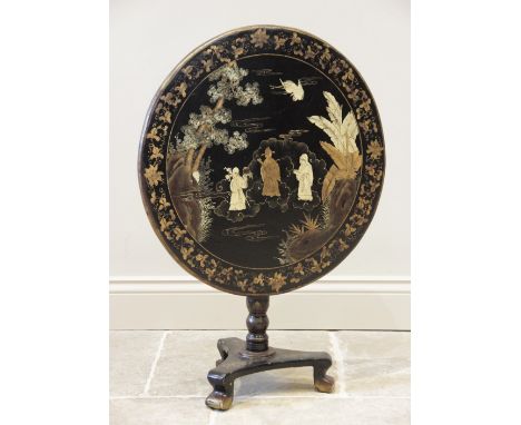 A Victorian Japanned hardwood pedestal table, the circular tilt top with a gilt foliate trailing frieze enclosing a central p