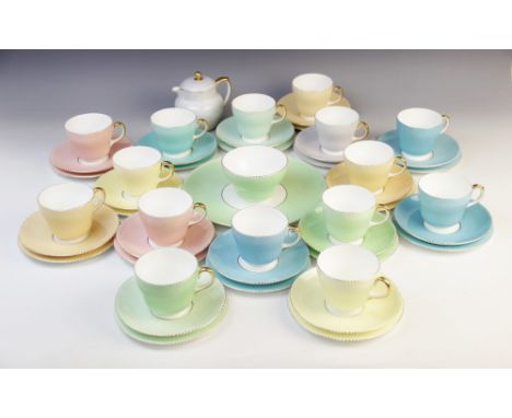 A Wedgwood pastel part tea service, 20th century, each piece with pastel body in shades of blue, green, yellow and puce, with