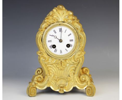 A late 19th century French Japy Freres ormolu mantel clock, the lancet shaped clock case cast in relief with foliate scrolls 