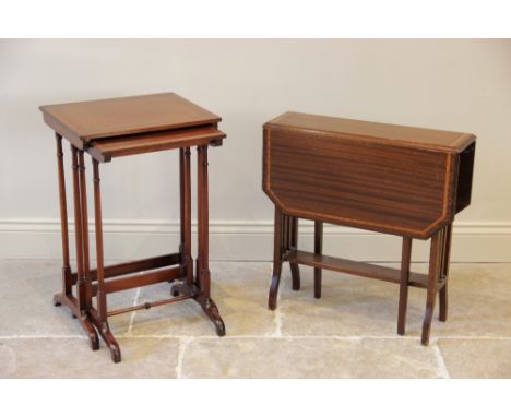 An Edwardian mahogany Sutherland table, the rectangular drop leaf top with satinwood cross banding and canted corners, raised
