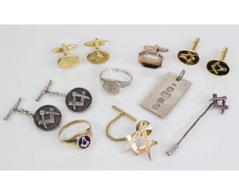 A selection of Masonic jewellery, to include: a 9ct gold enamel swivel signet ring, the central oval swivelling panel decorat