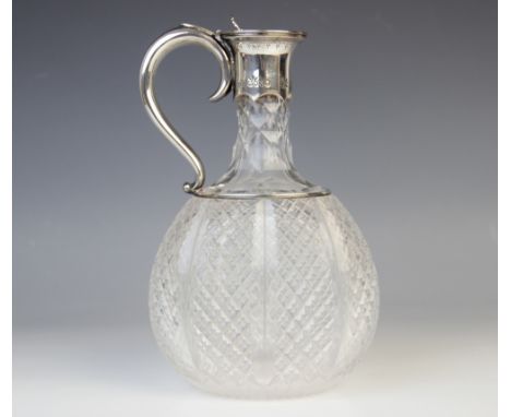 A Victorian cut glass silver mounted decanter by Horace Woodward & Co, London 1887, of compressed baluster form with faceted 
