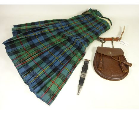 Scots kilt with leather Sporran and a silver mounted skean-dhu with Celtic carved handle and leather sheath, Edinburgh 1980  