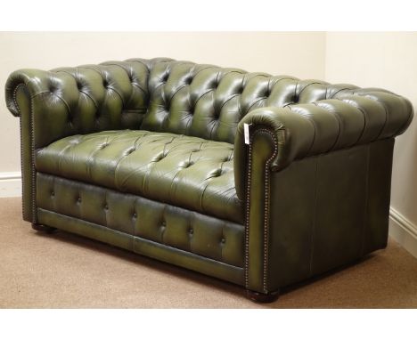 Two seat Chesterfield sofa upholstered in buttoned green faux leather, W155cm   Condition Report   Click here for further ima