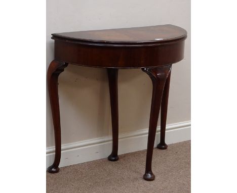 Reproduction mahogany demi-lune fold over card table, cabriole legs with single pull out action, W77cm, H74cm, D39cm (closed)