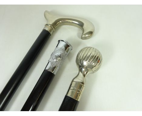 Ebonised 'Coldstream Guards' walking stick and two other ebonised walking sticks with silver plated handles (3)   Condition R