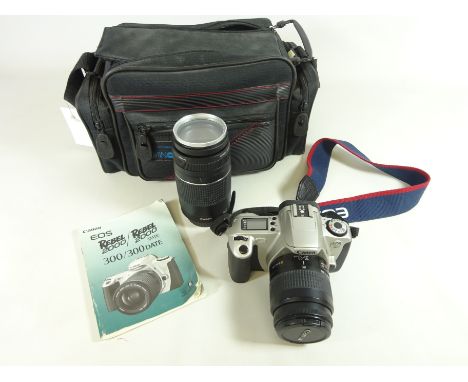 Canon EOS 300 SLR film camera with a Canon EF 35-80mm lens and a Canon EF 75-300mm lens, in a fitted bag with instructions   