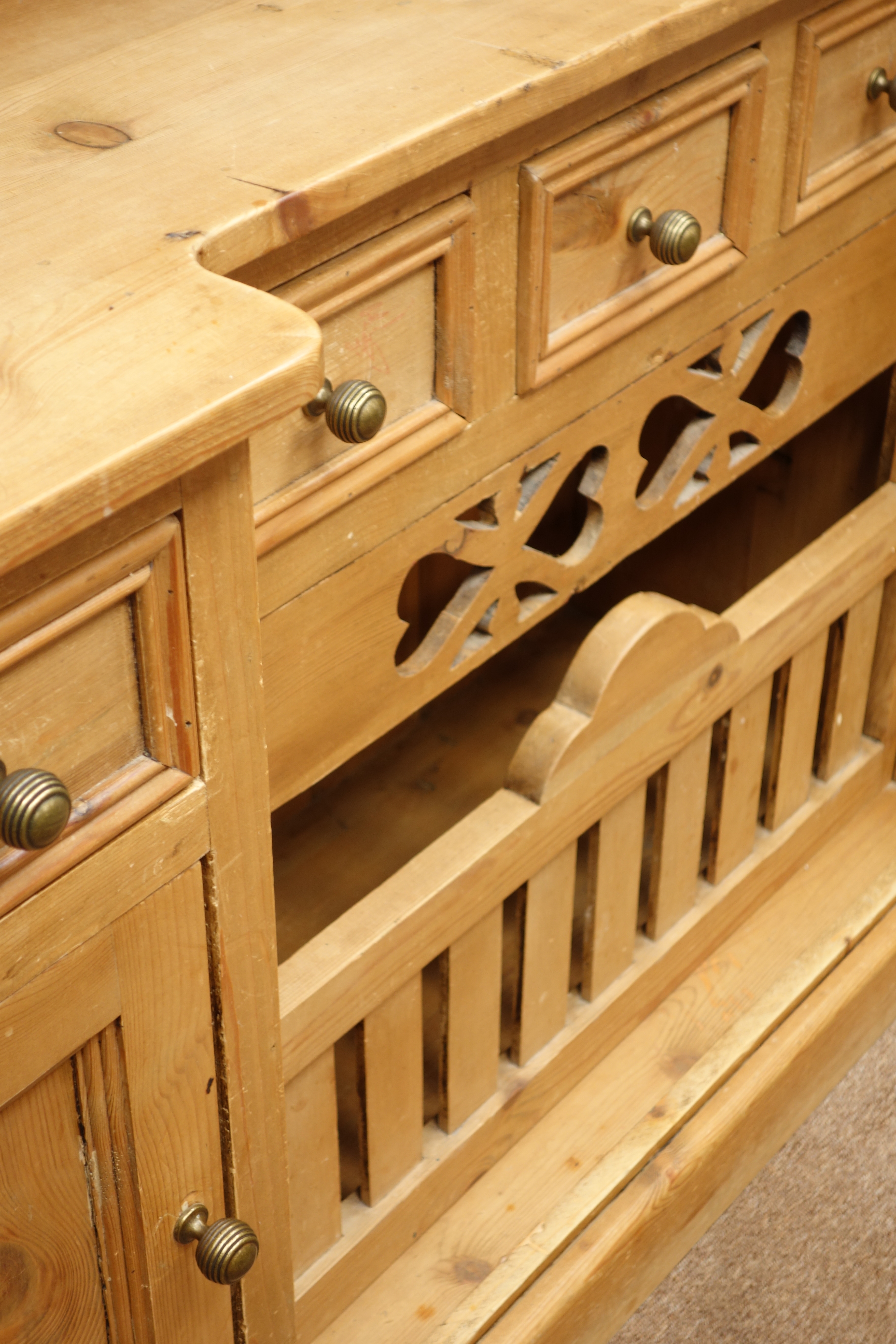 Pine chicken coop dresser, reverse break front, five drawers and two