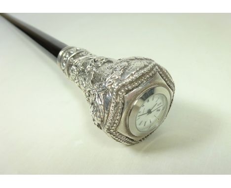 20th Century ebonised walking stick with a white metal embossed handle and clock stamped 925   Condition Report   Click here 