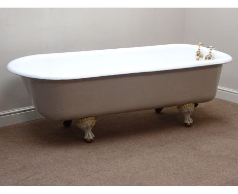 Early 20th century cast iron roll top enamel bath, brass finish taps, on painted and gilt ball and claw feet, L180cm   Condit