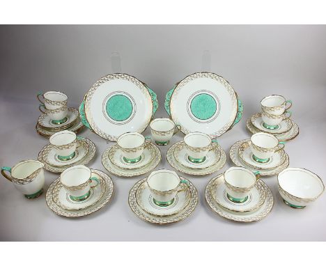 A Royal Albert Crown china porcelain part teaset comprising two cake plates, twelve tea plates, twelve saucers, twelve teacup