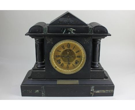 A Victorian black marble architectural cased mantel clock, the circular dial with exposed escapement, movement stamped Ansoni