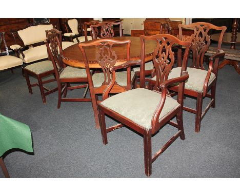 A set of eight Chippendale style mahogany dining chairs, pierced vase splats, green upholstered lift-out seats on chamfered l