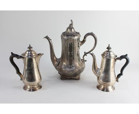 A pair of silver plated cafe au lait pots, together with a silver plated coffee pot with seated Chinese figure finial (a/f)