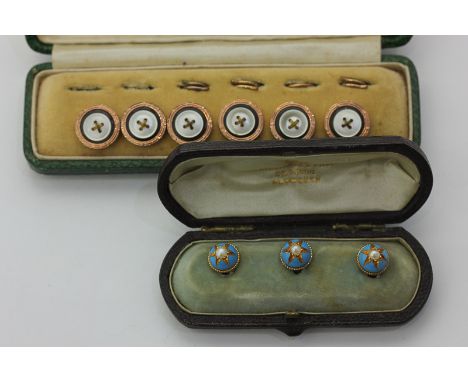A cased set of three gold, enamel and seed pearl studs, and a cased set of six gilt metal buttons