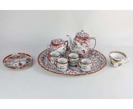 A porcelain teacup, with polychrome decoration depicting dragons and a porcelain part teaset, decorated with Japanese figure 