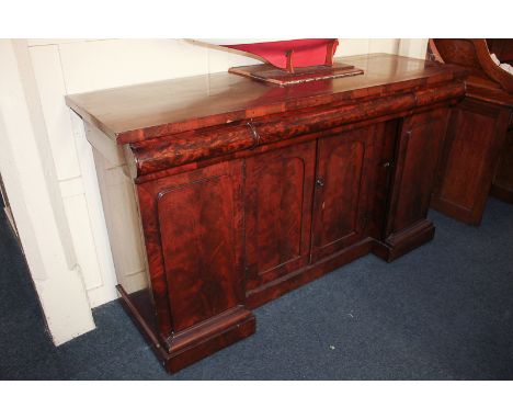 A Victorian flame mahogany sideboard with three drawers over four panel doors, on plinth base, 167cm wide