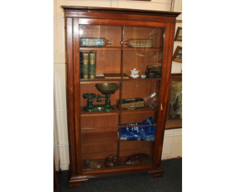 A Victorian mahogany bookcase with glazed panel door enclosing four shelves, on bracket feet, 89.5cm