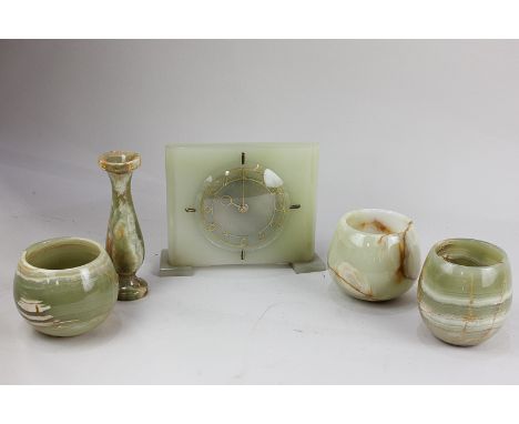 An Art Deco style green onyx mantel clock of rectangular form with brass chapter ring, 15cm high, together with four various 