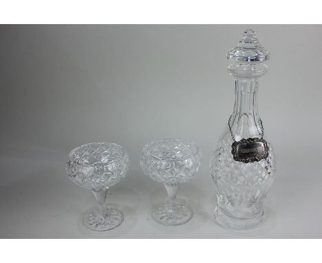 A Waterford crystal spirit decanter with silver sherry decanter label, and two Edinburgh crystal dessert glasses