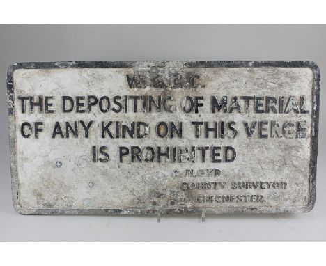 A West Sussex County Council street sign, 'The depositing of material of any kind on this verge is prohibited A Floyd County 