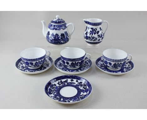 A collection of Coalport blue and white pottery comprising a child's teapot decorated with a Willow style pattern, a milk jug