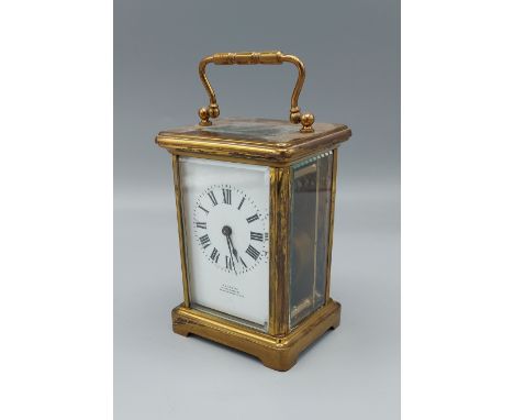 A brass cased carriage clock retailed by J. C. Vickery Regent Street, 11.5cms tall 