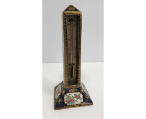 A Booths chinoiserie pattern pottery thermometer stand of column form set with a Negretti &amp; Zambra of London alcohol ther