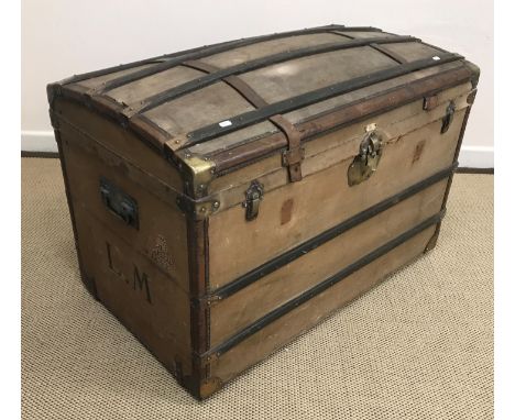 A 19th Century French strap work decorated studded leather bound canvas covered dome top trunk, 100 cm wide x 58 cm deep x 66