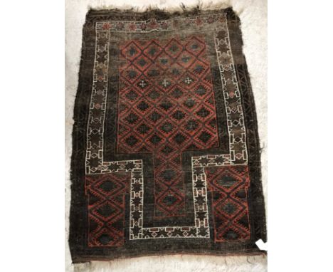 A Persian runner, the central panel set with stylized flower head motifs on a blue ground within a stepped cream, salmon pink