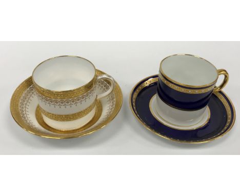 A Royal Crown Derby royal blue gilt and jewelled banded set of six coffee cans and saucers together with a Mintons gilt decor