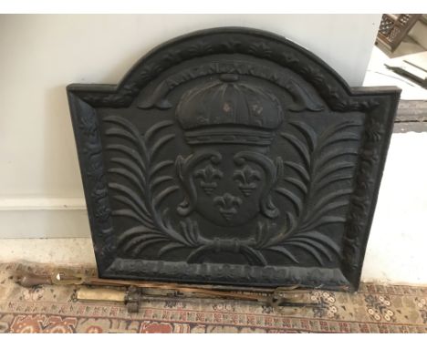 A modern cast iron fire back in the 17th Century style 46cm x 50cm , togther with a bayonet, fire side fork and poker