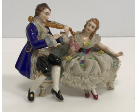 A collection of various Continental figure groups in the Meissen or Dresden manner including courting couple with birdcage an