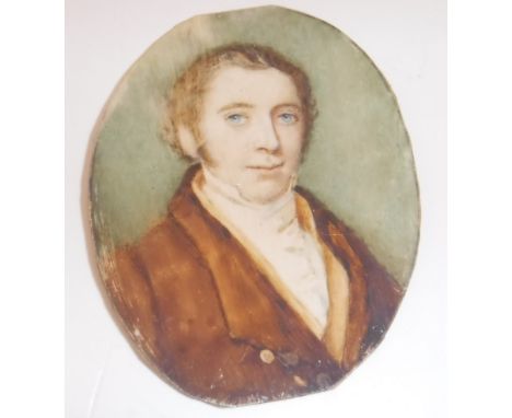 19TH CENTURY ENGLISH SCHOOL "Young gentleman with blue eyes in brown coat with white stock", a miniature portrait study, head