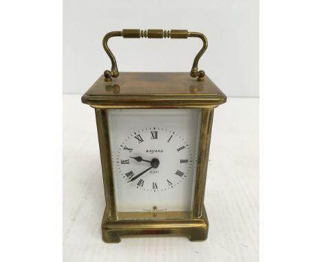 A brass cased carriage clock, the dial with Roman numerals inscribed "Bayard 8 day", 11.5 cm high, together with a brass case