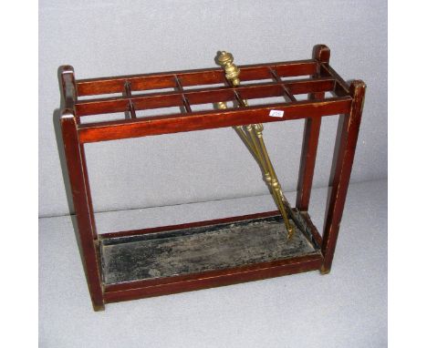 An antique stick stand and fire tools, measuring 27.5" tall as a size guide.