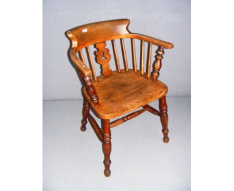 An antique oak smokers bow chair, measuring 30.5" tall as a size guide.