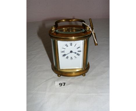 A good quality curved brass and beveled glass carriage clock measuring 11.5cm tall as a size guide.