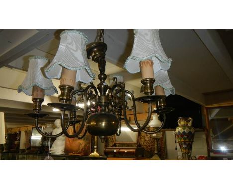 A 6 lamp brass ceiling light.