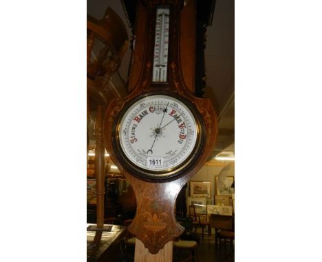 A mahogany inlaid barometer.