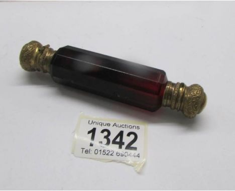 A Victorian ruby glass double ended scent bottle with gilt metal caps, 12cm long.