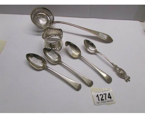 A silver sifter spoon, 4 silver teaspoons and a silver napkin ring.