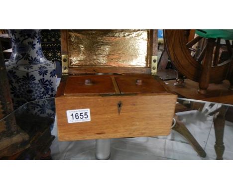 A mahogany tea caddy.